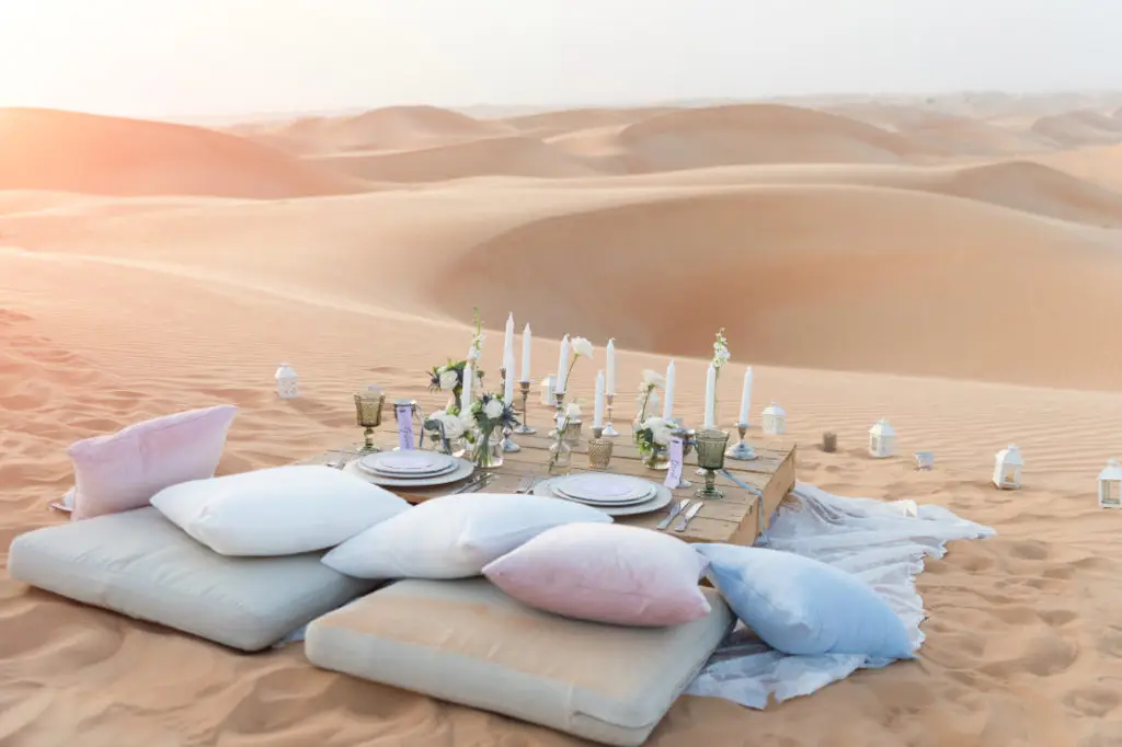 MoroccoTours.us About Us team guiding tourists through Moroccan desert landscapes